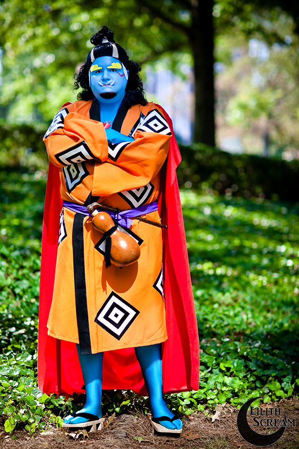 Man with blue skin and orange robes