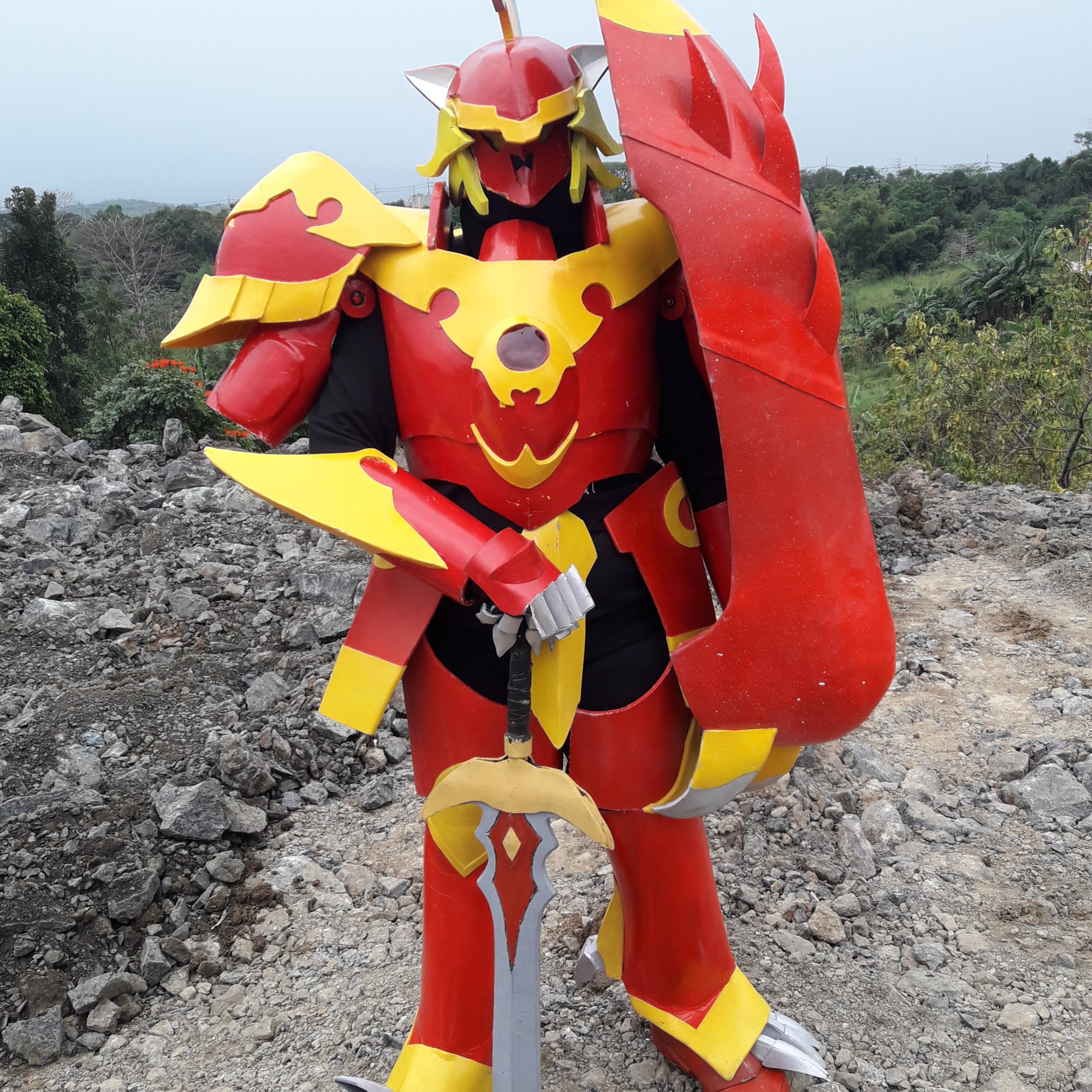 Cosplayer in armor painted in bright, warm colors