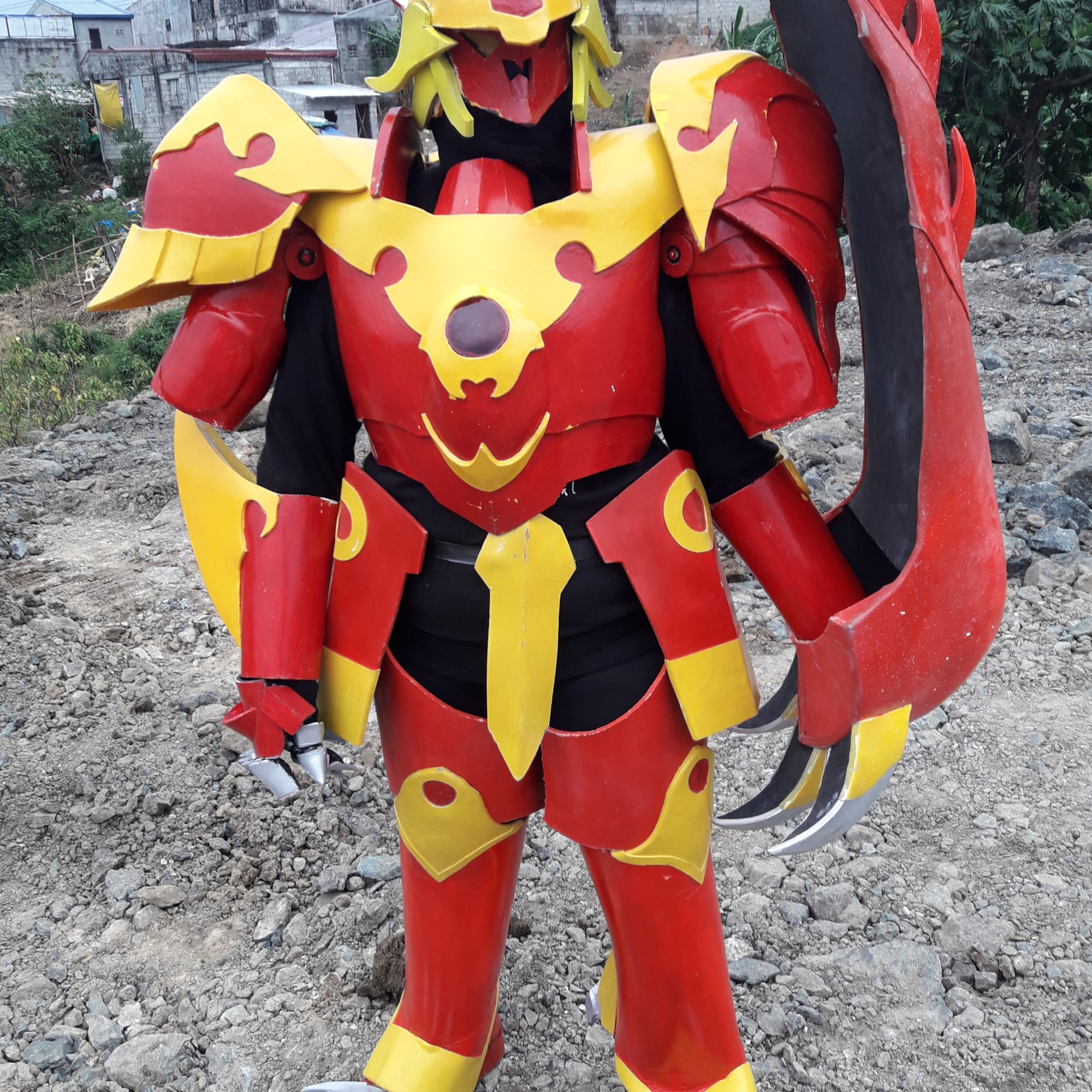 Cosplayer in armor painted in bright, warm colors