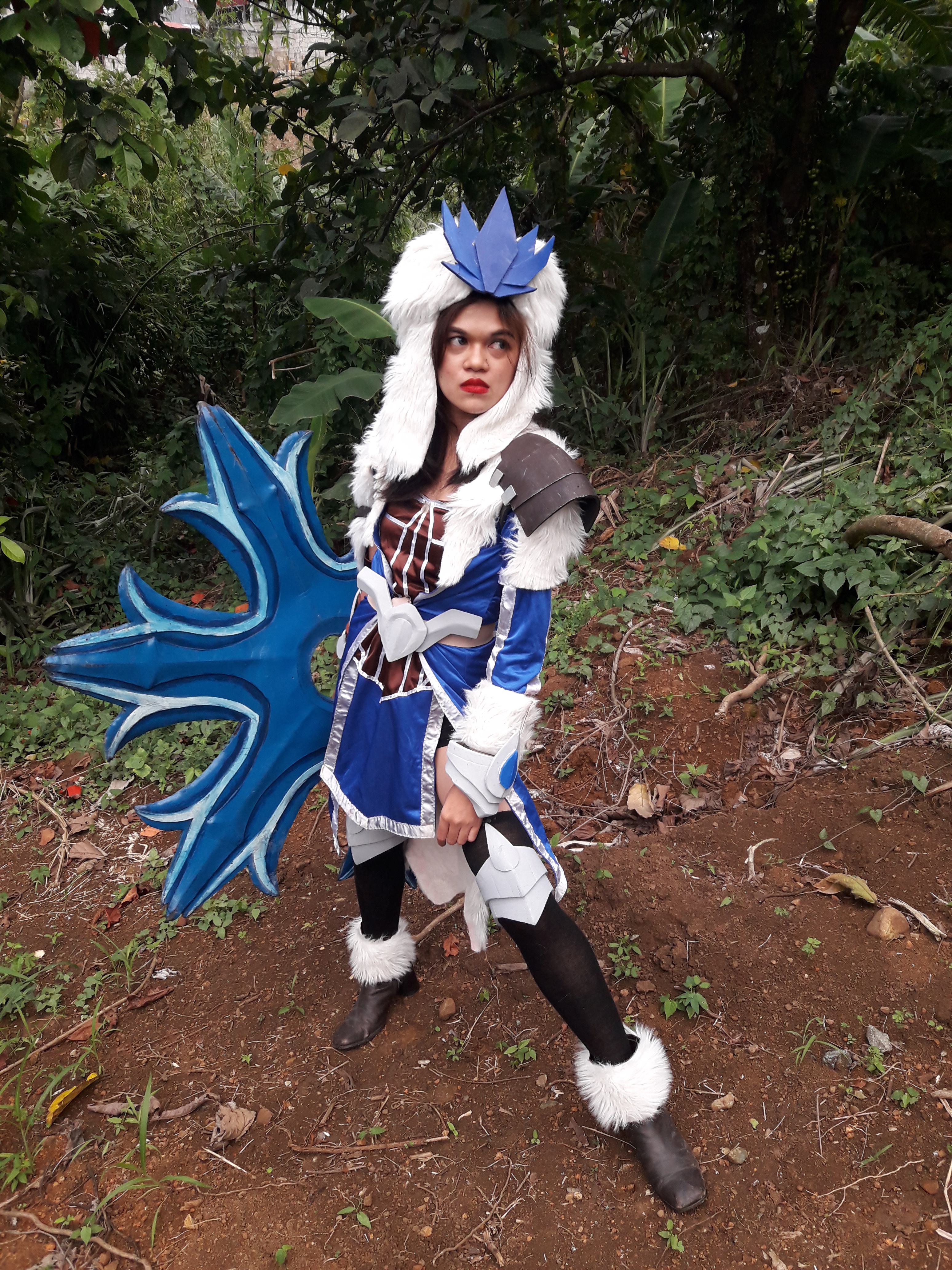 Cosplayer with fancy, furry clothes and a giant shuriken