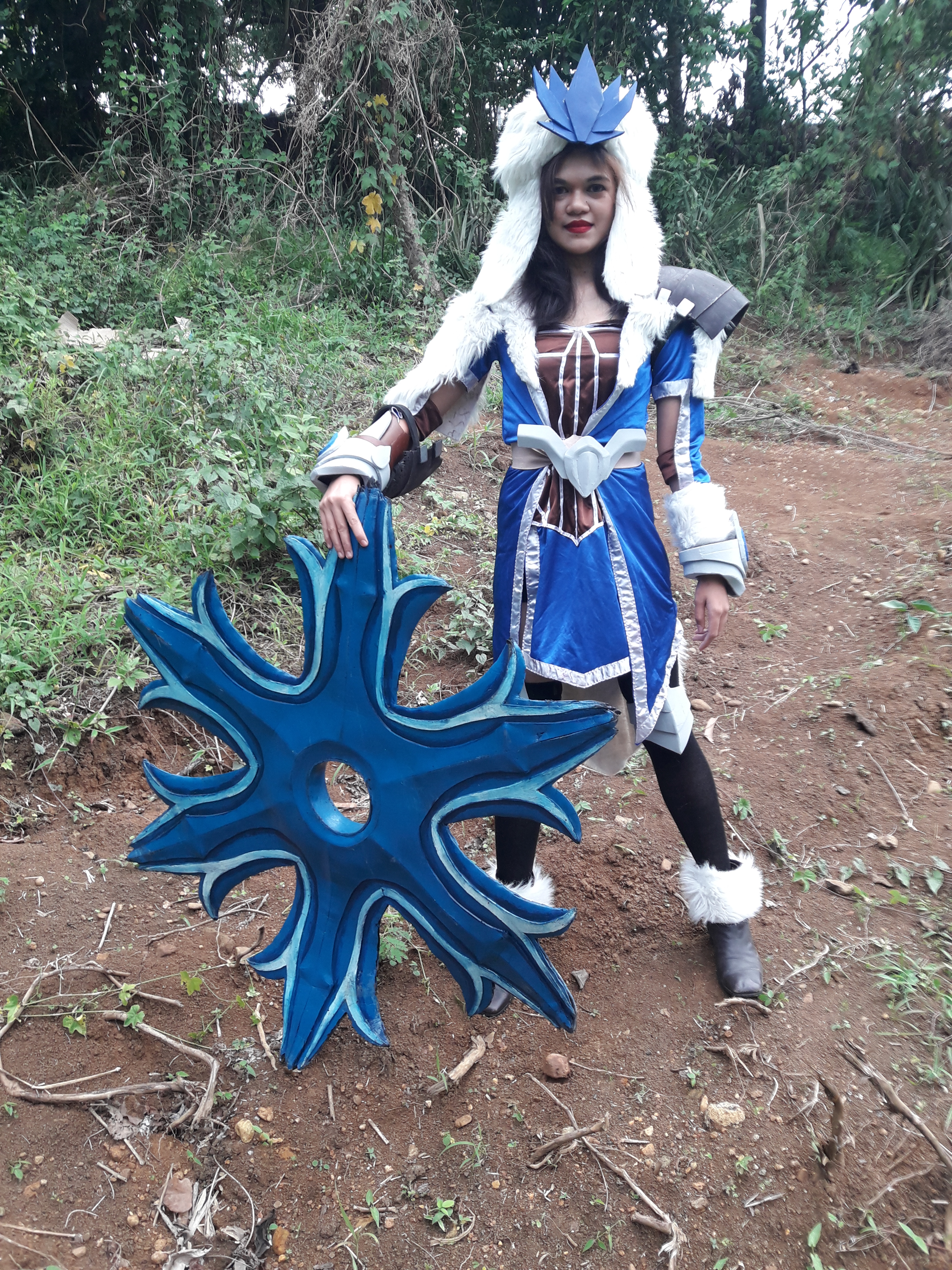 Cosplayer with fancy, furry clothes and a giant shuriken