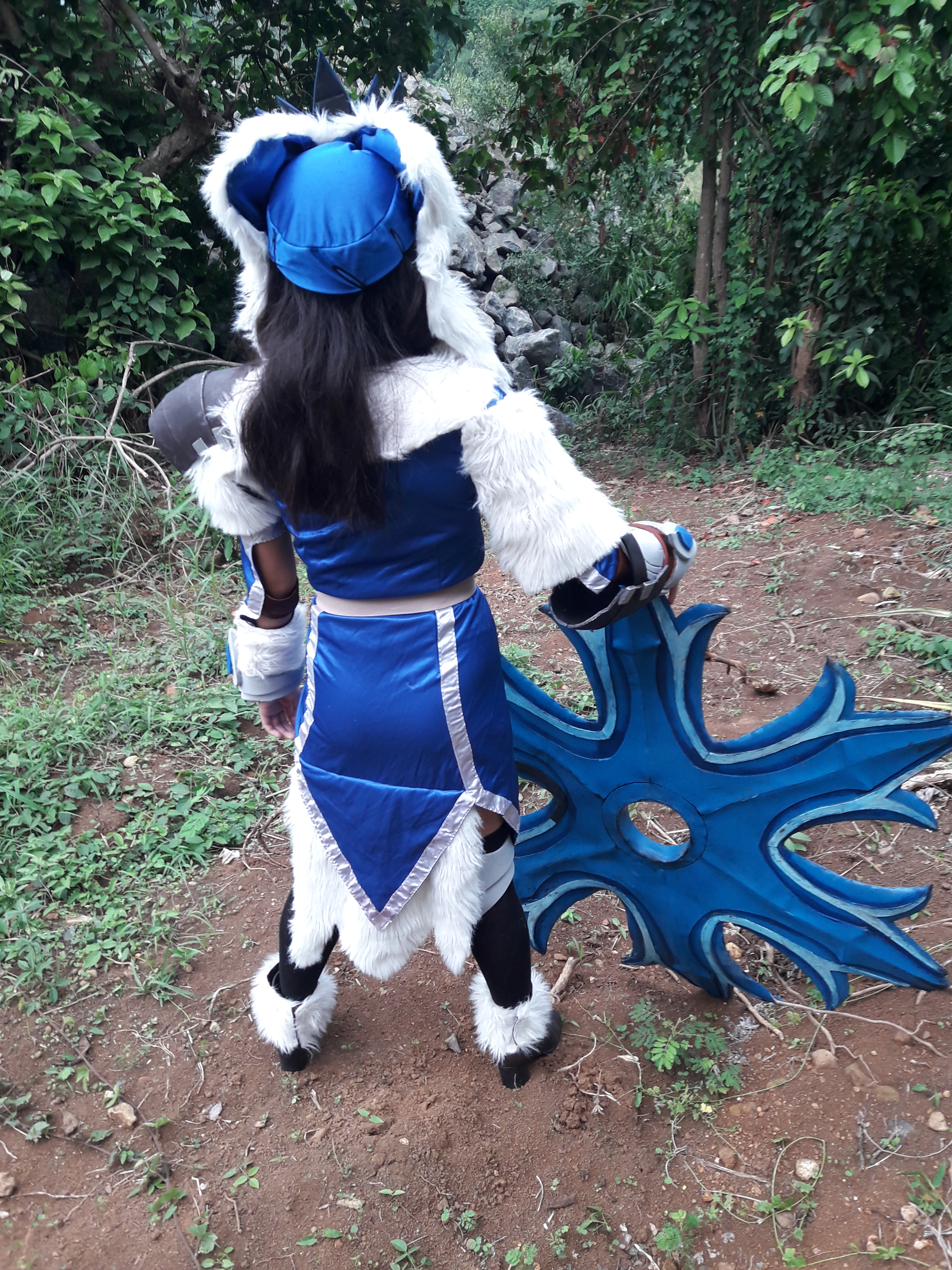 Cosplayer with fancy, furry clothes and a giant shuriken
