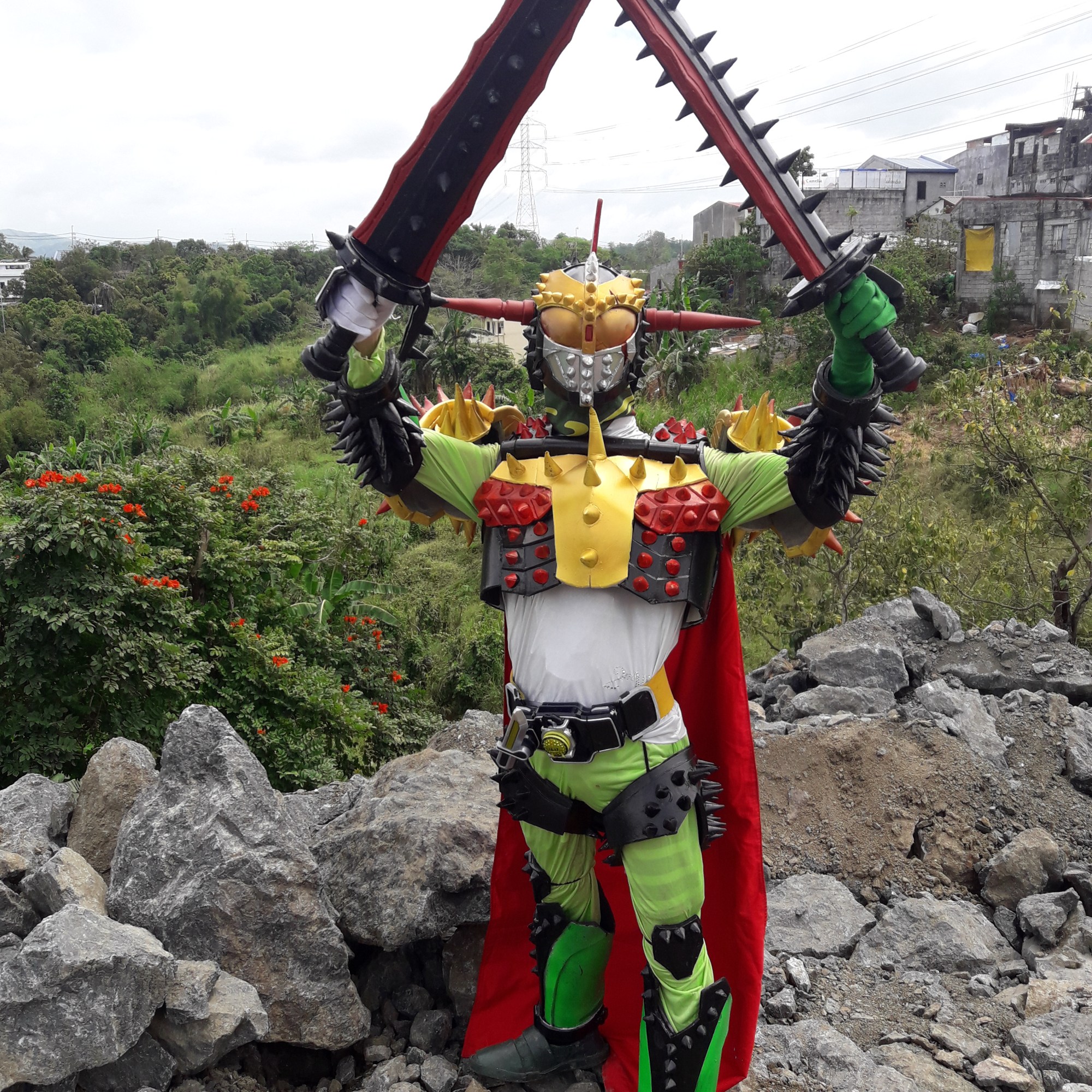 Cosplayer dressed in brightly colored bug-like costume with lots of spikes