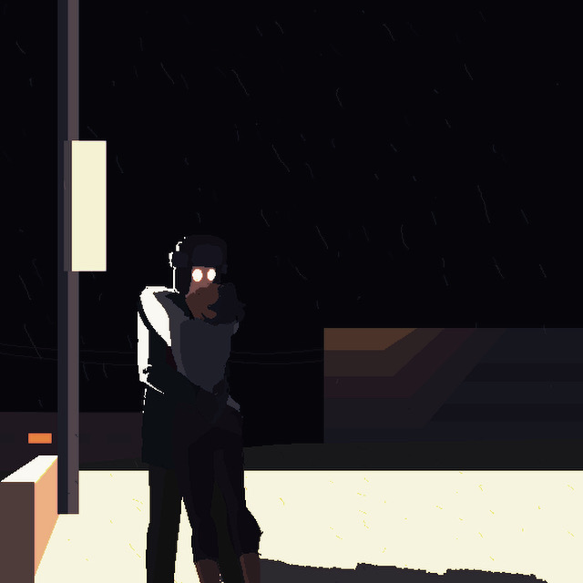 Figures kissing under a light