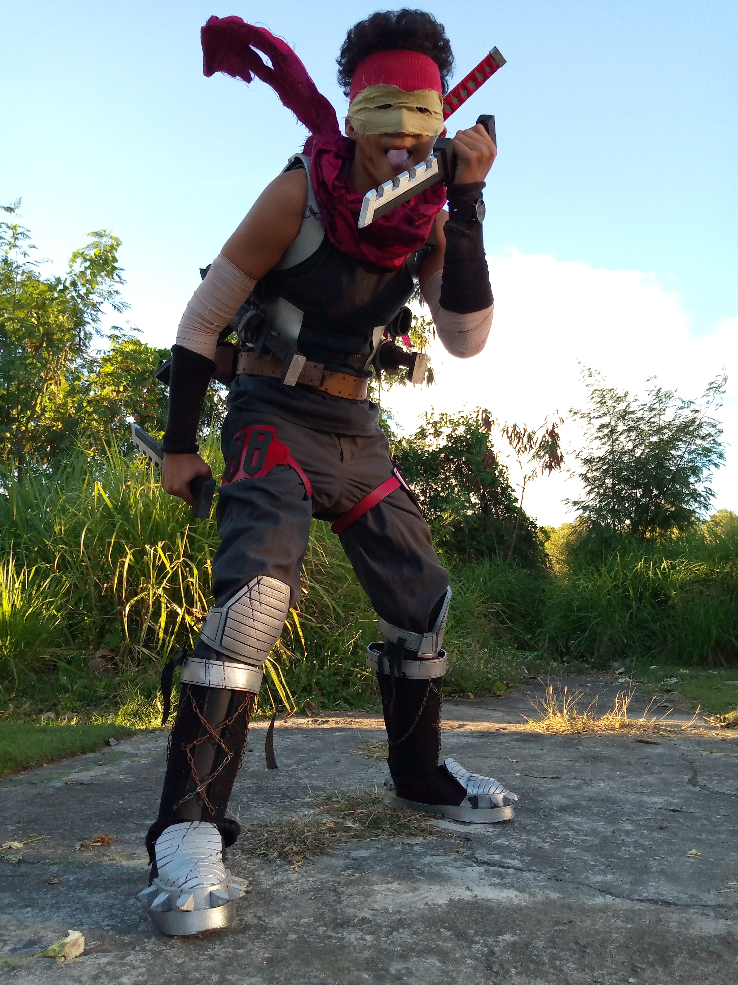 Ninja-looking guy, licking knife