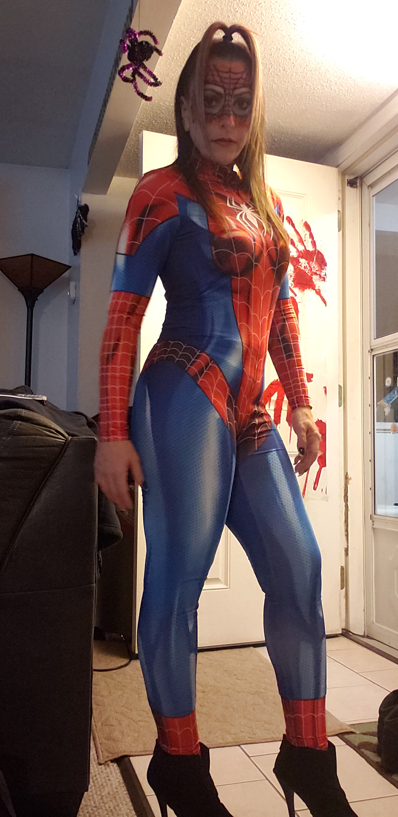 Red, white and blue shiny Spider suit. Just your friendly neighborhood Spider-girl!