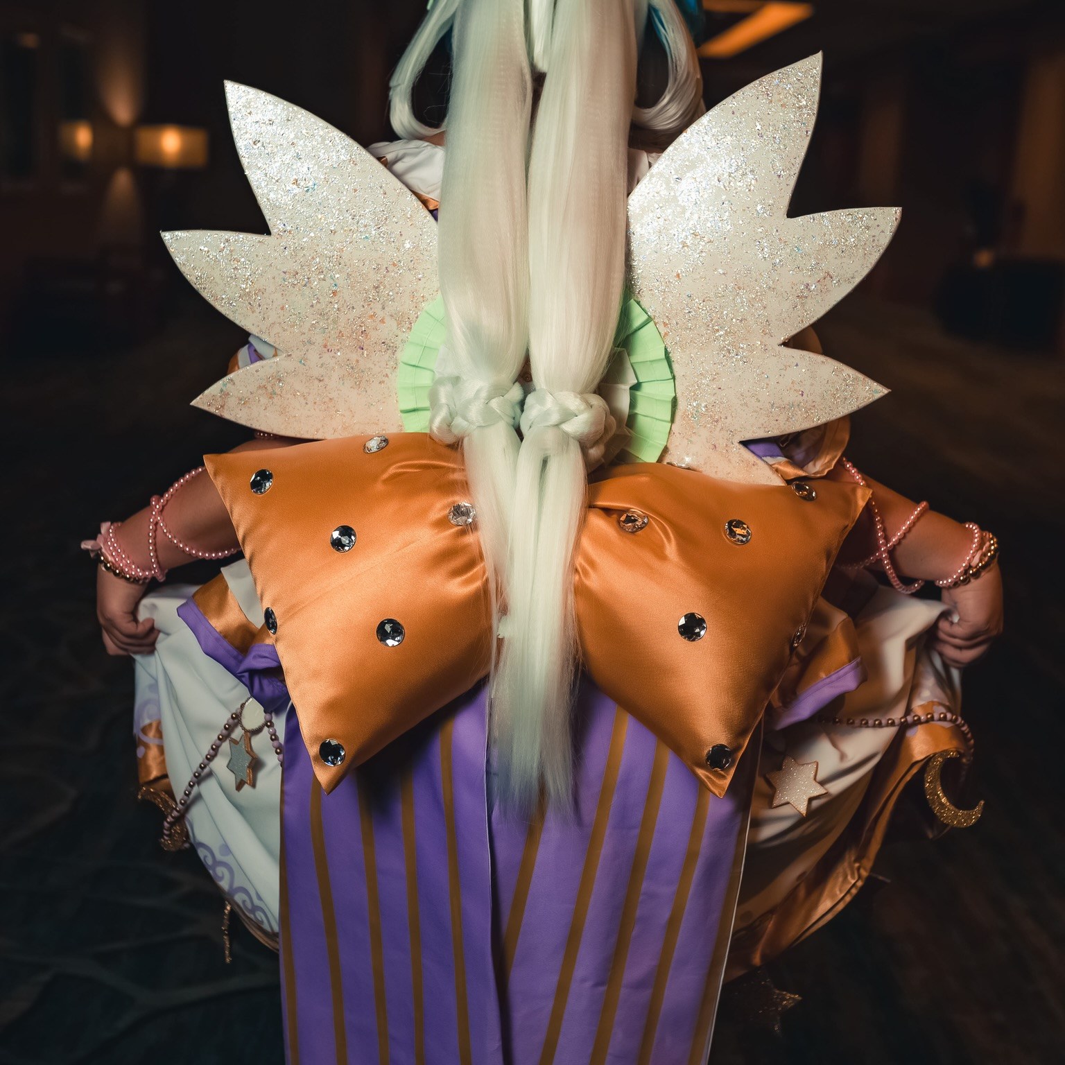 Everything is hand made and I have a digital build book on my Instagram (@summerfirecosplay) under PriPara. The wig was dyed by my own paint water method (it’s non crunchy & tutorial is on my TikTok @summer_fire_cosplay) all the bows are plush made so they are soft. The heart trim was designed in my design space for cricket & is htv. The cosplay is 6 pieces, wig, blouse, over skirt, underskirt, & petticoat. All made by me. The shoes & stockings are made/heavily altered by me as well. The opal gems are all resin and the wings are Eva foam with opal glitter over them as well.