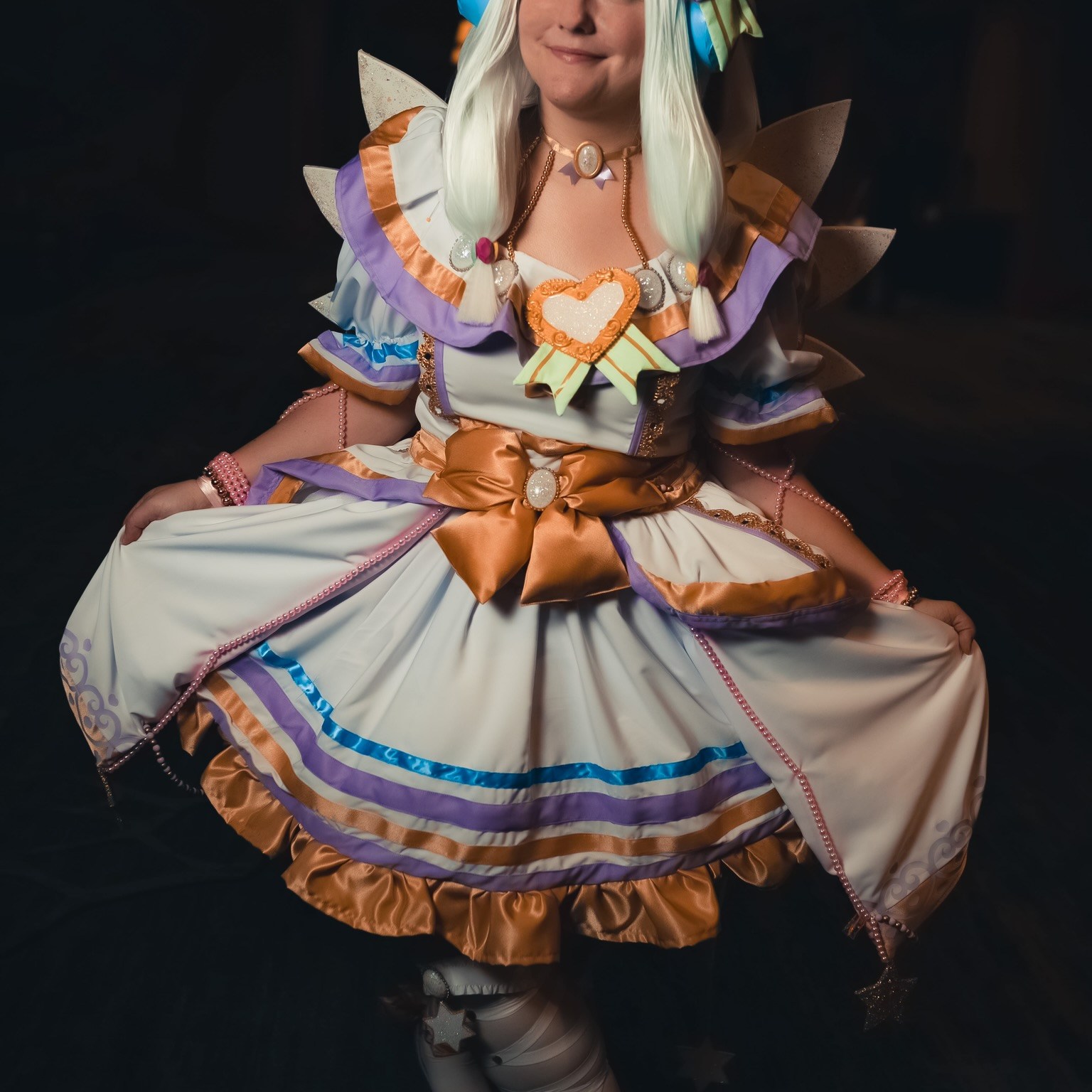 Everything is hand made and I have a digital build book on my Instagram (@summerfirecosplay) under PriPara. The wig was dyed by my own paint water method (it’s non crunchy & tutorial is on my TikTok @summer_fire_cosplay) all the bows are plush made so they are soft. The heart trim was designed in my design space for cricket & is htv. The cosplay is 6 pieces, wig, blouse, over skirt, underskirt, & petticoat. All made by me. The shoes & stockings are made/heavily altered by me as well. The opal gems are all resin and the wings are Eva foam with opal glitter over them as well.